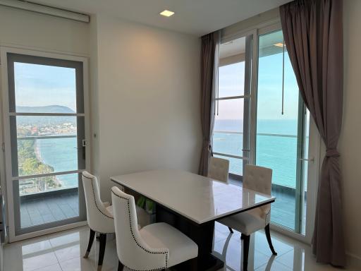 Bright dining room with ocean view and modern furniture