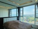 Spacious bedroom with large windows and scenic view