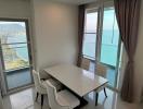 Dining room with ocean view, modern table, and natural light