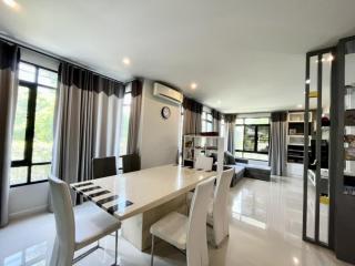 Spacious dining room with modern furniture and natural light