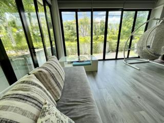 Bright and modern living room with floor-to-ceiling windows