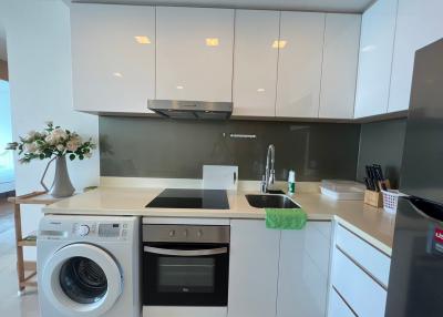 Modern kitchen with built-in appliances and ample cabinet space