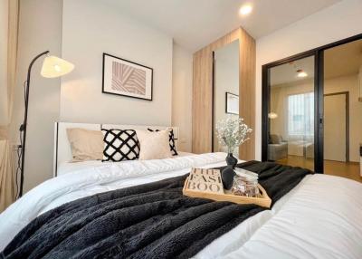 Modern bedroom with a comfortable bed, stylish decor, and en-suite bathroom access
