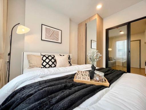 Modern bedroom with a comfortable bed, stylish decor, and en-suite bathroom access