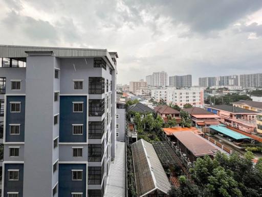 City view from a high vantage point showing apartment buildings and overcast sky