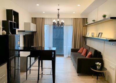 Modern living room with adjacent kitchenette