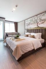 Elegant bedroom with a large bed and artistic wall painting