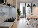 Modern kitchen with open plan leading to a well-lit living room