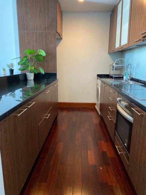 Modern kitchen with wooden cabinets and granite countertops