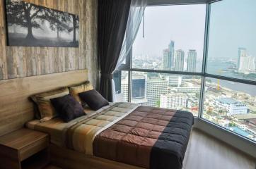 Modern bedroom with city skyline view