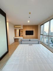 Modern living room with large windows and city view