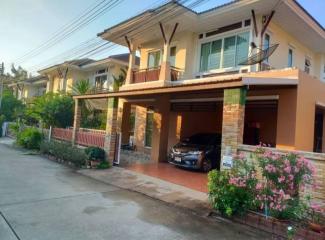 Spacious two-story house with covered parking and balcony