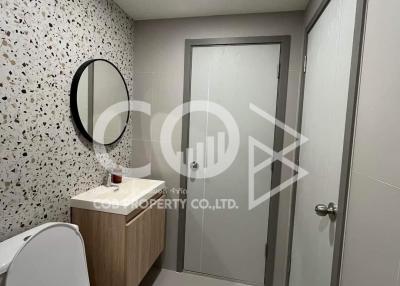 Modern styled bathroom with patterned wall tiles