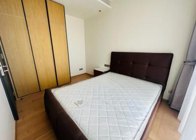 Spacious bedroom with a large bed and built-in wardrobe