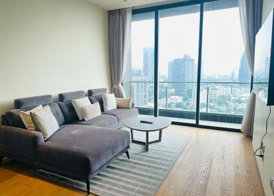 Modern living room with large windows and city view