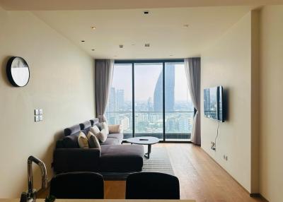 Modern living room with large windows and city view