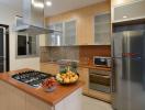 Modern kitchen with stainless steel appliances and wooden cabinets