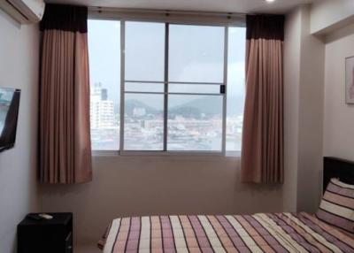 Modern Bedroom with Large Window and City View