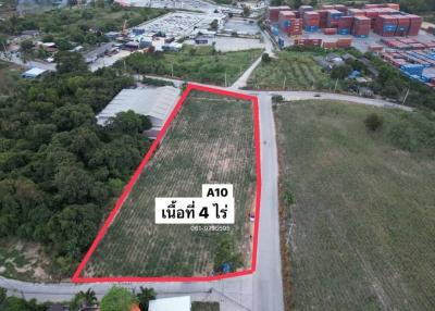 Aerial view of a marked land plot for sale