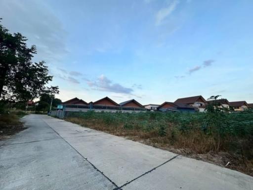 Suburban neighborhood with row houses viewed from a concrete path