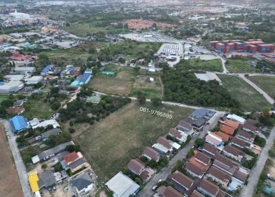 Aerial view of a residential area with mix of buildings and undeveloped land