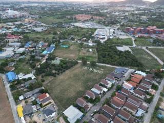 Aerial view of a residential area with mix of buildings and undeveloped land
