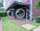 Modern residential building entrance with landscaped garden