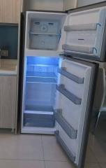 Open white refrigerator in kitchen setting