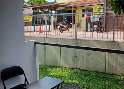 Cozy covered patio area with a view of a residential neighborhood