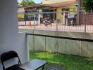 Cozy covered patio area with a view of a residential neighborhood