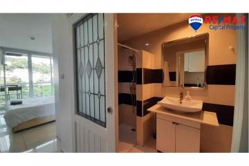 Bright bathroom with modern fixtures and a view