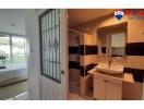 Bright bathroom with modern fixtures and a view