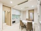 Modern kitchen with adjacent dining area in a bright apartment