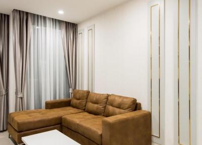 Modern living room interior with leather sofa and white coffee table