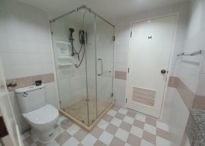 Modern bathroom with glass shower and tiled floor