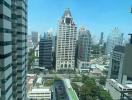 Cityscape view from a high-rise apartment window