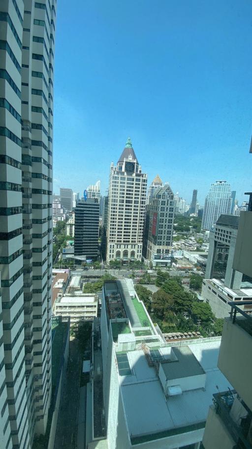 Cityscape view from a high-rise apartment window