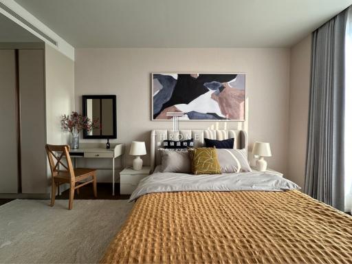 Elegantly decorated bedroom with a large bed and artwork