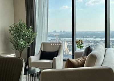 Modern living room with large windows and city view