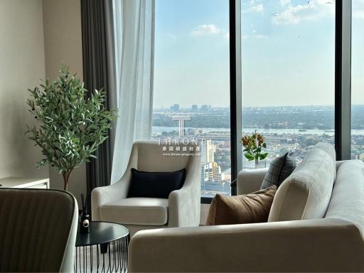 Modern living room with large windows and city view