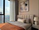 Elegant bedroom with a large window offering a city view, featuring a comfy bed with stylish bedding and a prominent art piece on the wall.