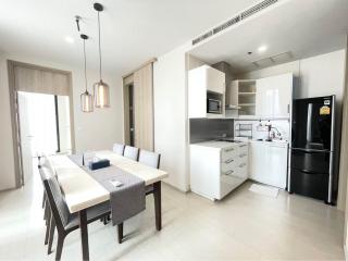 Modern kitchen with dining table set in a bright apartment