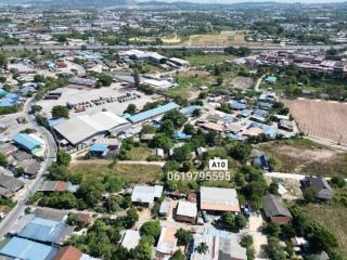 Aerial view of a residential area with a variety of properties and surrounding landscape