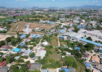 Arial view of a property surrounded by various residential and industrial structures