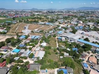 Arial view of a property surrounded by various residential and industrial structures