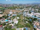 Arial view of a property surrounded by various residential and industrial structures