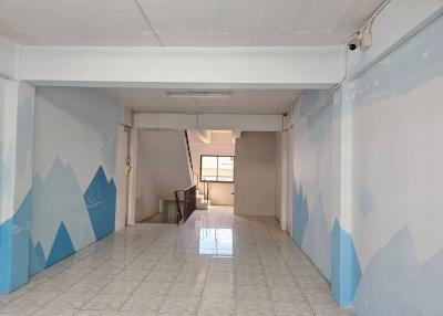 Spacious unfurnished interior of a building with artistic wall designs