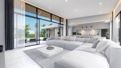 Modern spacious living room with open kitchen design, large sofa, and floor-to-ceiling windows