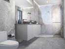 Modern bathroom with grey stone tiles and walk-in shower