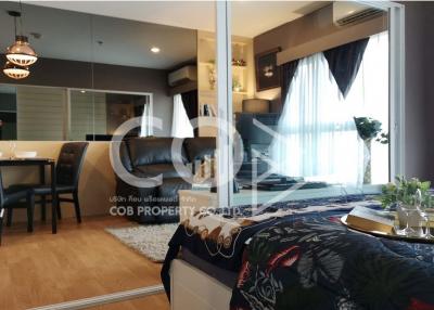 Modern Bedroom with Reflective Glass Door and Open Plan Living Area Design